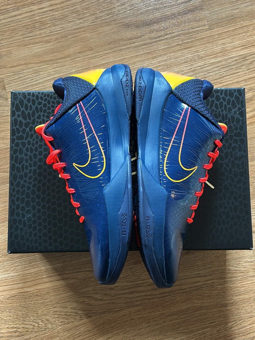 Nike Men’s Blue Basketball Shoes with Yellow Swoosh and Red Laces